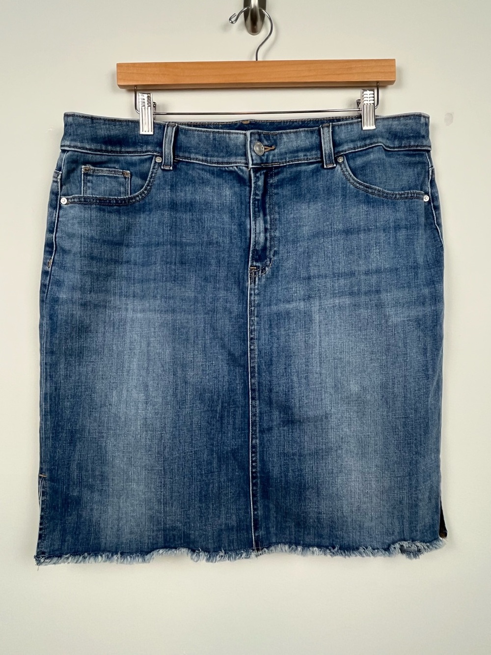 Chico’s medium wash knee length raw hem denim skirt, size 14.